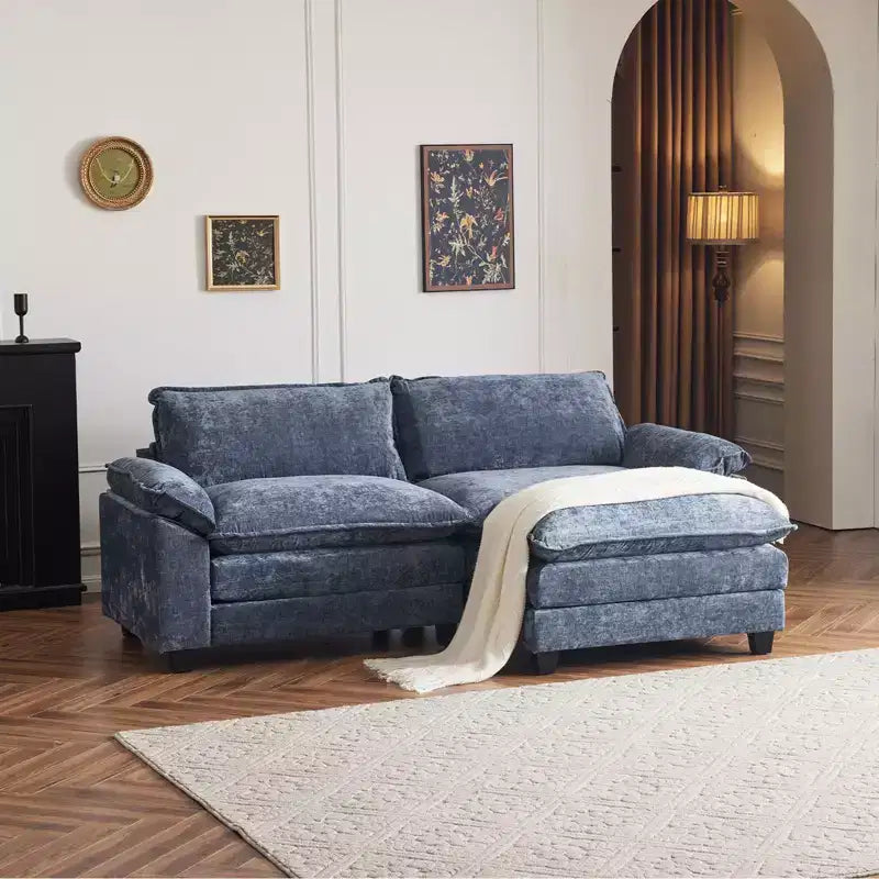 Karl Home | Divano 305 cm L a due strati con bracciolo imbottito e cuscini in ciniglia nera con pouf