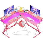 Scrivania a L Greenstell 128 cm – Superficie in fibra di carbonio con luce LED e prese di corrente, tavolo da gaming con supporto per monitor e gancio per cuffie