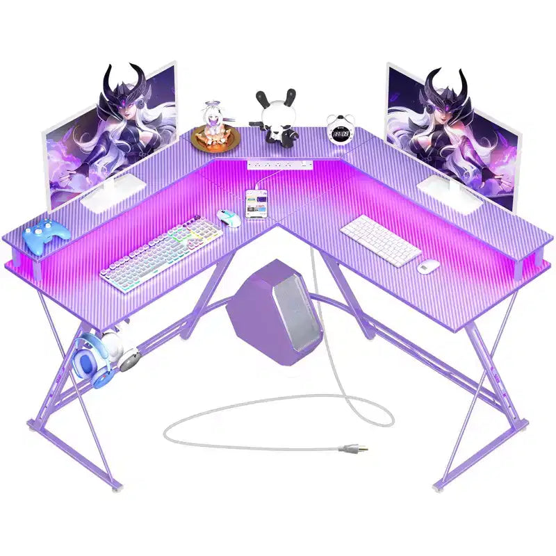 Scrivania a L Greenstell 128 cm – Superficie in fibra di carbonio con luce LED e prese di corrente, tavolo da gaming con supporto per monitor e gancio per cuffie
