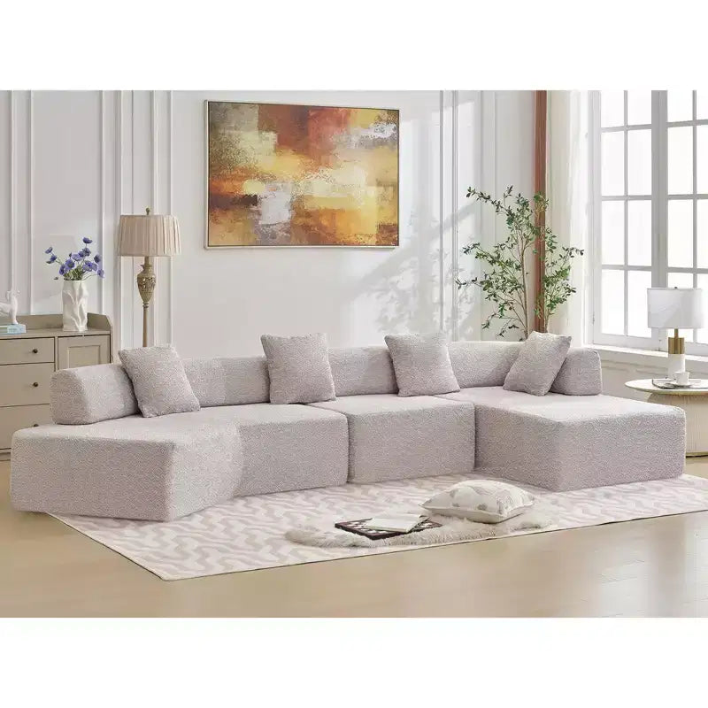 GDFStudio Arvik 140 Moderno Divano Sezionale a L a 4 Posti Rivestito in Bouclé con 4 Cuscini