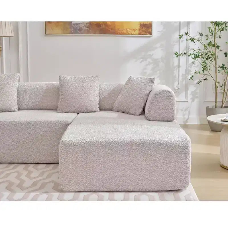 GDFStudio Arvik 140 Moderno Divano Sezionale a L a 4 Posti Rivestito in Bouclé con 4 Cuscini