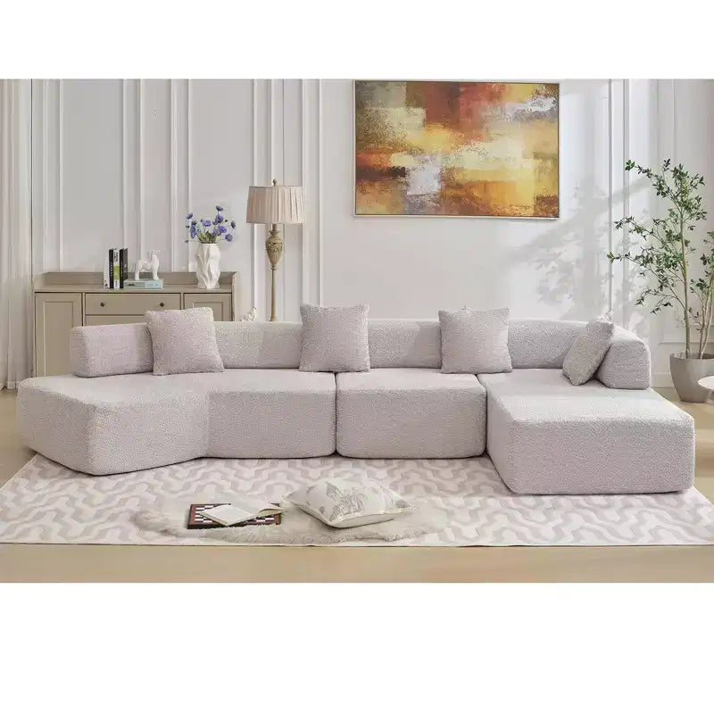GDFStudio Arvik 140 Moderno Divano Sezionale a L a 4 Posti Rivestito in Bouclé con 4 Cuscini