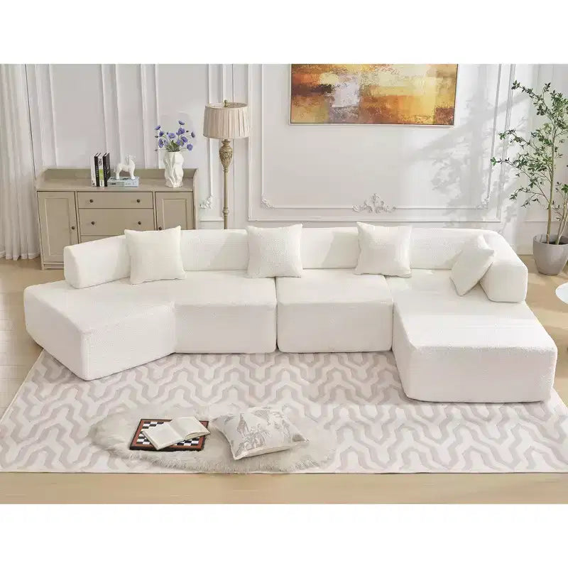 GDFStudio Arvik 140 Moderno Divano Sezionale a L a 4 Posti Rivestito in Bouclé con 4 Cuscini